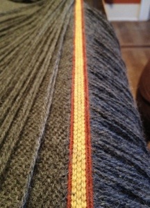 The tablet woven band showing correct tensioning of the beat to the cloth ends per inch.