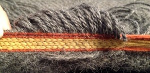 Tablet weaving showing a missed thread.